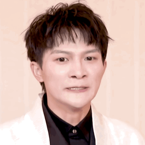 Young Man in Black Shirt and White Jacket