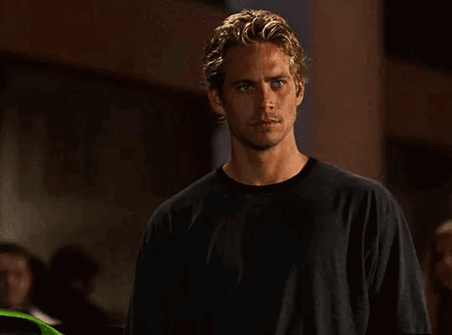 Young Man in Black Shirt in Dark Room