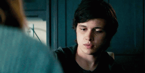 Young Man in Black Shirt Looking at Woman