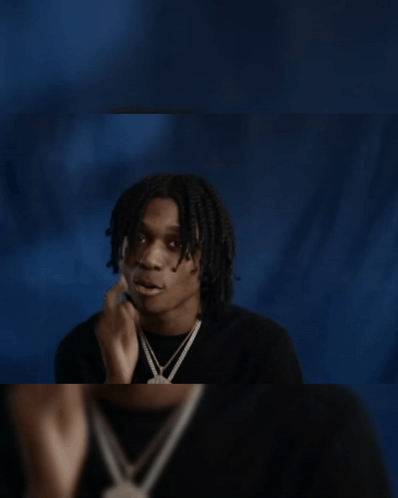 Young Man In Black Shirt Looking In Mirror GIF