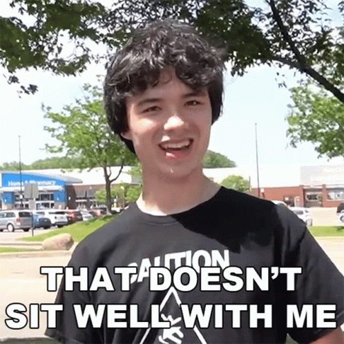 Young Man in Black Shirt That Doesn't Sit Well With Me