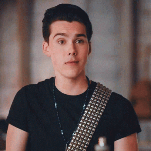 Young Man in Black Shirt With Studded Guitar Strap