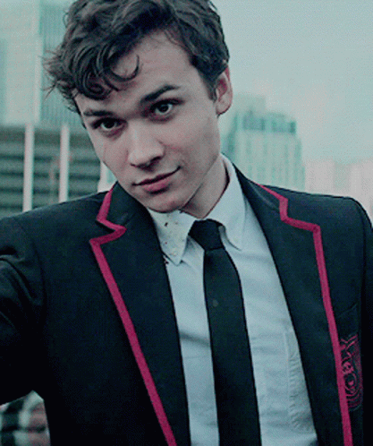 Young Man in Black Suit With Red Stripe Sleeves