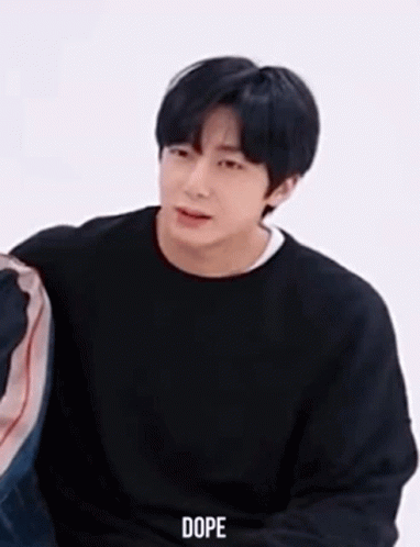 Young Man in Black Sweater Sitting