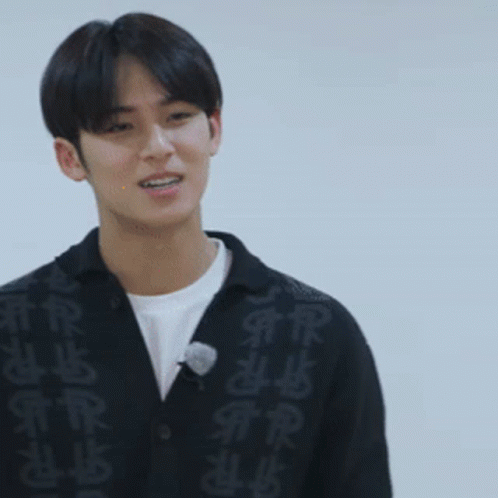 Young Man in Black Sweater With Chinese Characters