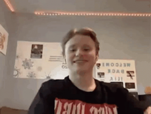 Young Man In Black T-Shirt Smiling GIF