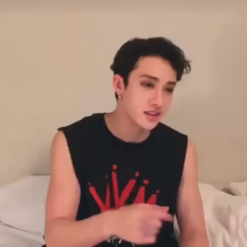 Young Man in Black Tank Top Red Writing