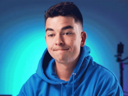 Young Man in Blue Hoodie Making Funny Face