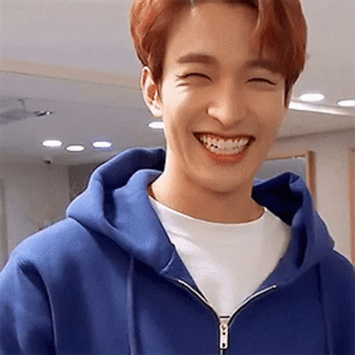 Young Man In Blue Hoodie Smiling GIF
