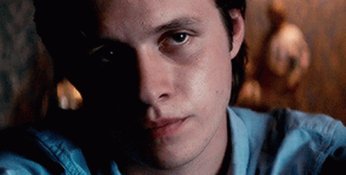 Young Man in Blue Shirt Close Up