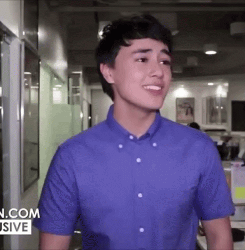 Young Man in Blue Shirt Smiling