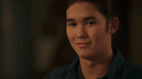 Young Man In Blue Shirt Smiling GIF
