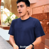 Young Man in Blue T-Shirt Saying Brother
