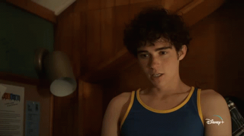 Young Man In Blue Tank Top With Disney Plus GIF