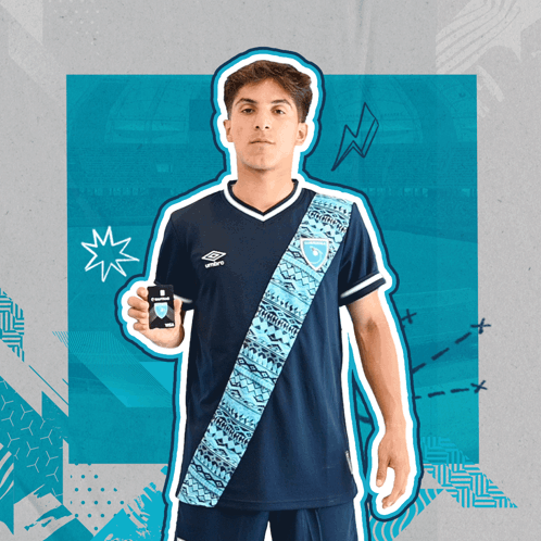 Young Man in Blue Umbro Shirt Holding Black Object