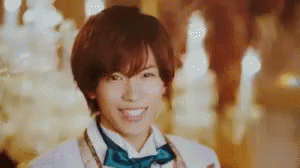 Young Man in Bow Tie and White Jacket Smiling