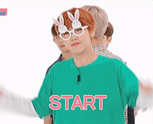 Young Man in Bunny Glasses and Green Shirt Saying Start