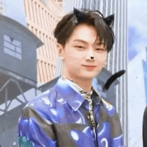 Young Man in Cat Ears and Blue Shirt