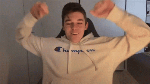 Young Man in Champion Hoodie Flexing