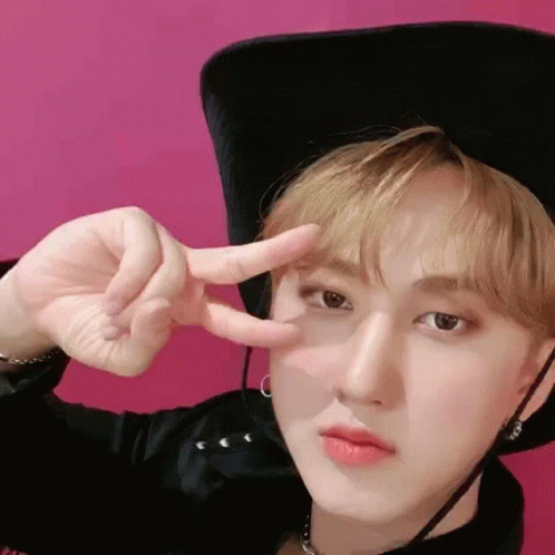 Young Man In Cowboy Hat Giving Peace Sign GIF