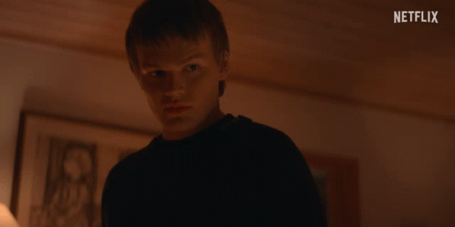 Young Man in Dark Room Netflix Logo