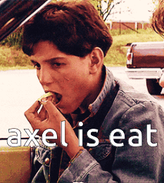 Young Man in Denim Jacket Eating