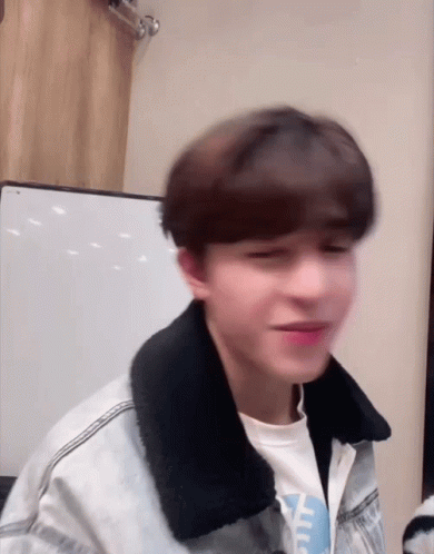 Young Man In Denim Jacket Making Funny Face GIF