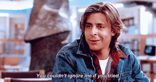 Young Man In Denim Jacket Talking To Someone GIF