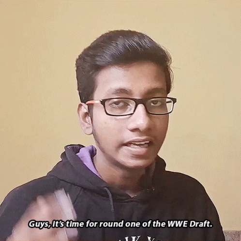 Young Man In Glasses And Black Hoodie Saying Guys It's Time For Round One Of The WWE Draft GIF