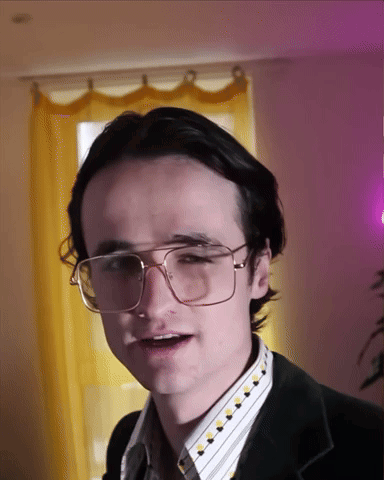 Young Man in Glasses and Black Jacket
