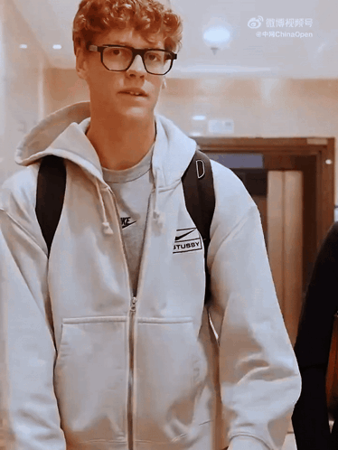 Young Man In Glasses And White Nike Sweatshirt GIF