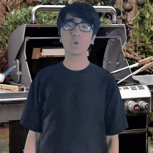 Young Man in Glasses at Grill
