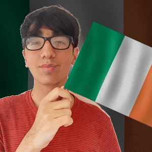 Young Man in Glasses Holding Green White and Orange Flag