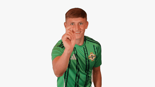 Young Man in Green Adidas Shirt Making Funny Face