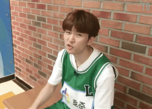 Young Man in Green and White Jersey With Letter L