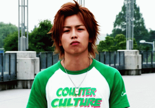Young Man in Green and White Shirt Saying Counter Culture