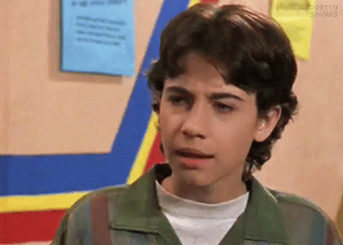 Young Man in Green Jacket with Blue and Yellow Stripe