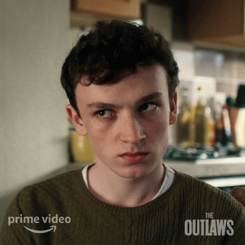 Young Man in Green Sweater The Outlaws