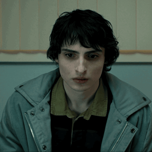 Young Man in Grey Jacket and Black Shirt