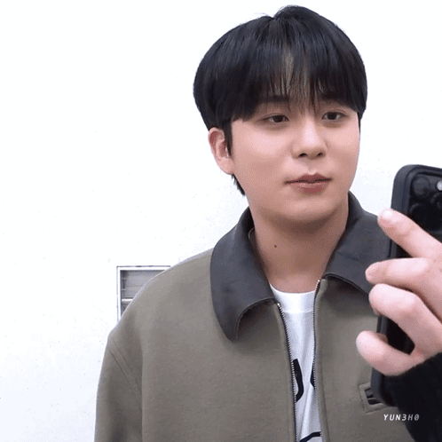 Young Man in Grey Sleeveless Shirt Making Heart