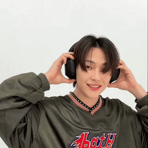 Young Man in Headphones and Abarth Jersey