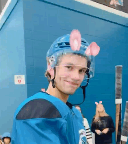 Young Man In Hockey Helmet With Bunny Ears GIF
