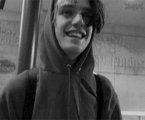 Young Man In Hooded Jacket Smiling GIF