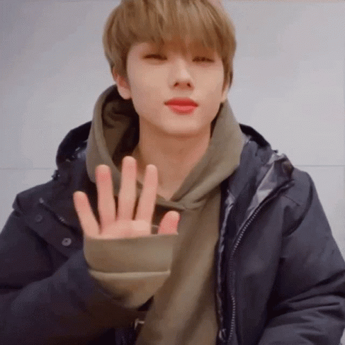 Young Man in Hoodie Making Peace Sign