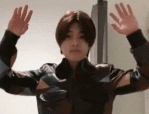 Young Man in Leather Jacket Arms Outstretched