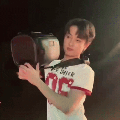 Young Man in Number 10 Jersey Holding Boxing Glove
