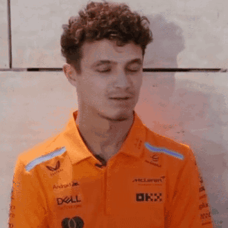 Young Man In Orange Polo With Dell Logo GIF