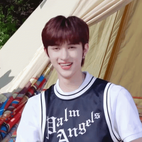 Young Man in Palm Angels Shirt Smiling