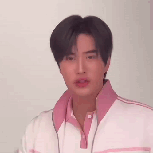 Young Man in Pink and White Jacket
