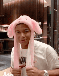 Young Man In Pink Bunny Hat And White Nike Shirt GIF